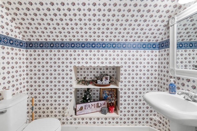 bathroom featuring toilet and sink