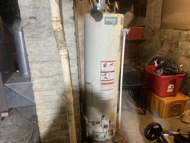 utility room with gas water heater