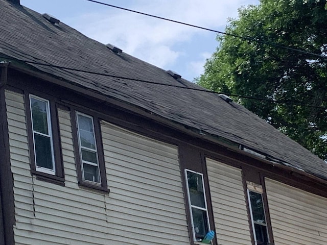 details featuring a shingled roof