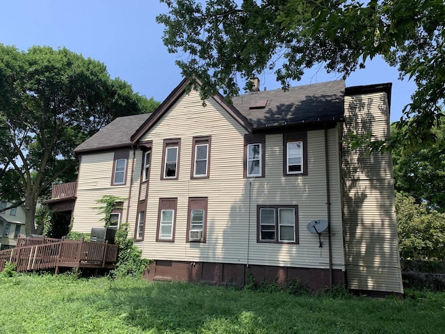 back of property featuring cooling unit