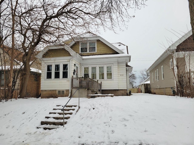 view of snow covered house