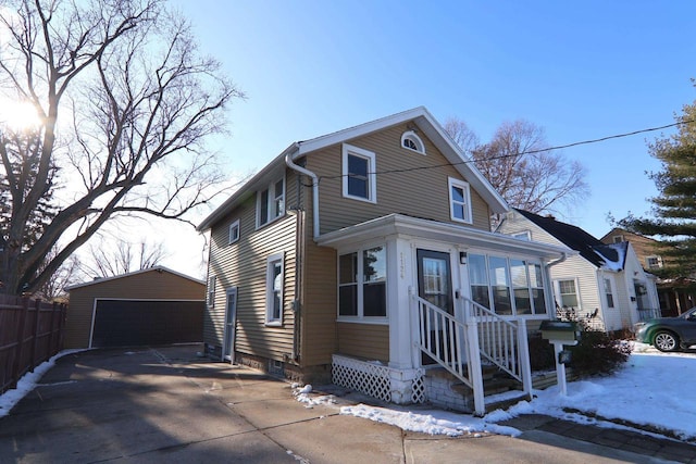 view of front of house featuring an outdoor structure and a garage