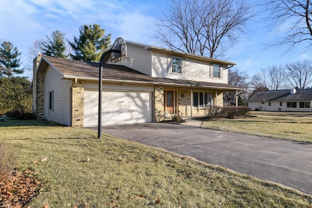 front of property featuring a front yard, a garage, and covered porch