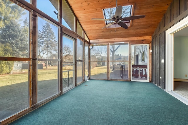 unfurnished sunroom with baseboard heating, ceiling fan, plenty of natural light, and lofted ceiling