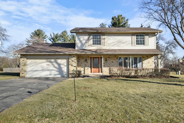 front facade featuring a front yard and a garage