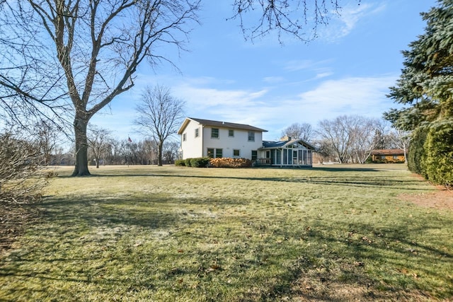 view of yard with a sunroom