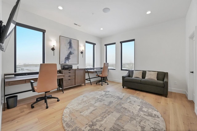 office space featuring light hardwood / wood-style floors