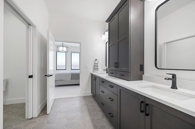 bathroom with tile patterned floors and vanity