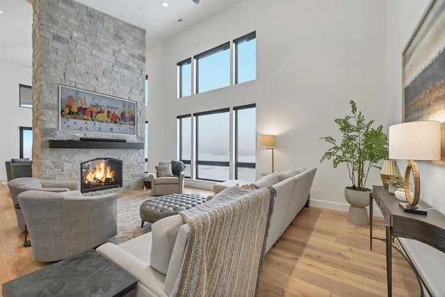 living room featuring light hardwood / wood-style floors and a fireplace