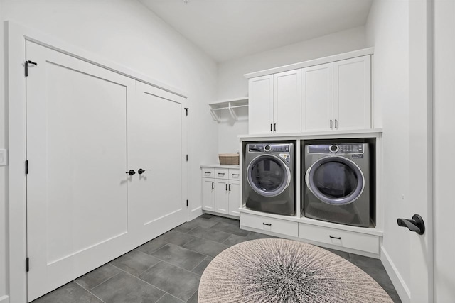 laundry room with cabinets and washer and dryer