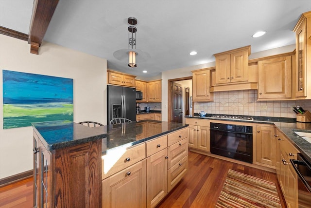 kitchen featuring dark hardwood / wood-style floors, a kitchen island, black appliances, beam ceiling, and hanging light fixtures