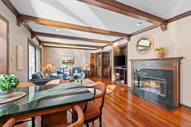 living room with dark hardwood / wood-style flooring and crown molding