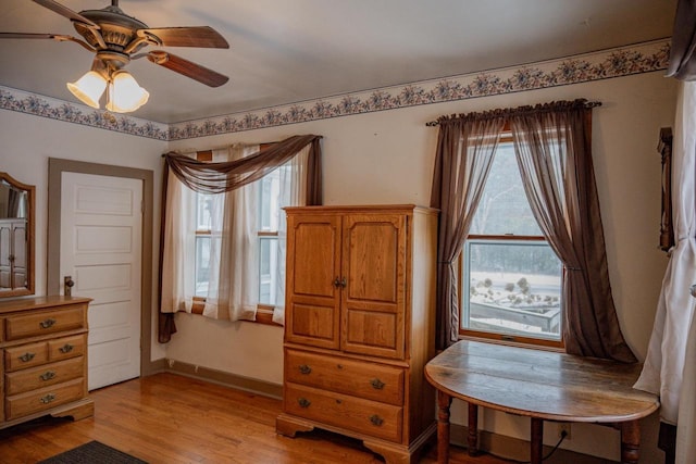 sitting room with light hardwood / wood-style flooring and ceiling fan