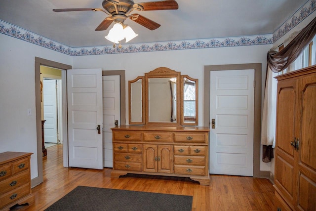 bedroom with ceiling fan and light wood-type flooring