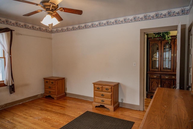 interior space with ceiling fan and light hardwood / wood-style floors