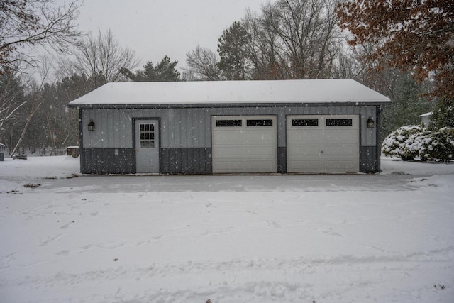 view of snow covered garage