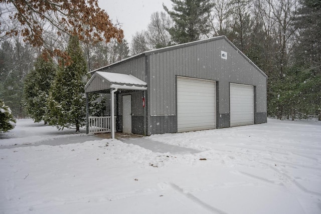 view of snow covered garage