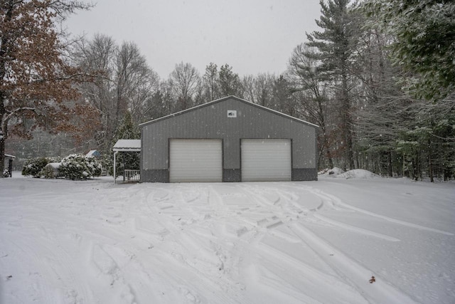 view of snow covered garage