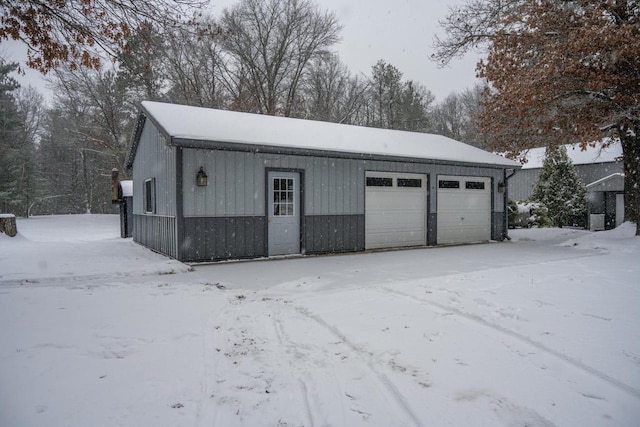 view of snow covered garage