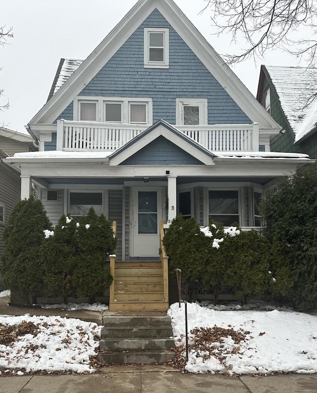 view of front of house featuring a balcony