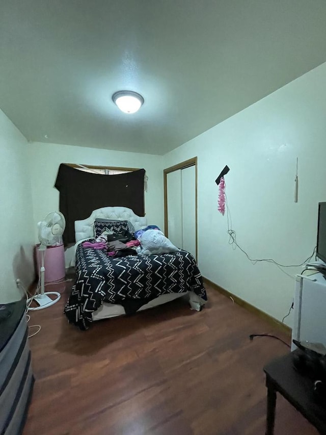 bedroom with hardwood / wood-style floors