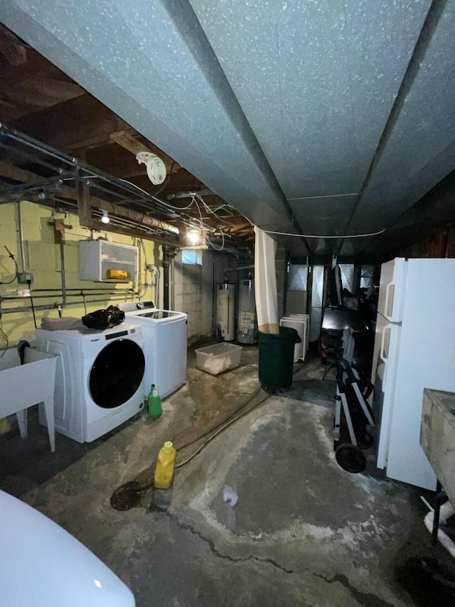 basement featuring white fridge, independent washer and dryer, electric panel, and water heater