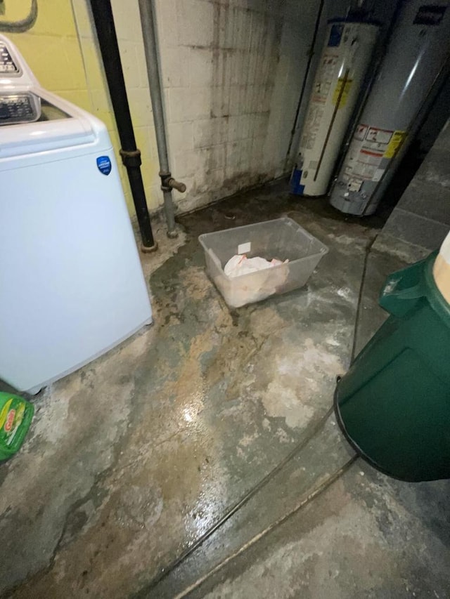 basement featuring washer / dryer and water heater