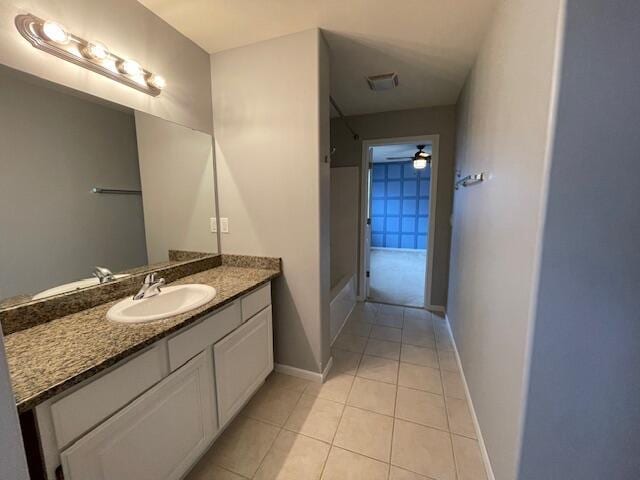 bathroom with tile patterned flooring, vanity, and ceiling fan