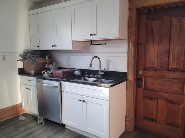 kitchen featuring stainless steel dishwasher, dark hardwood / wood-style floors, white cabinetry, and sink