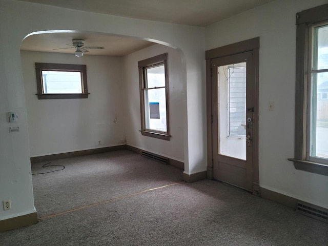 empty room featuring carpet and ceiling fan