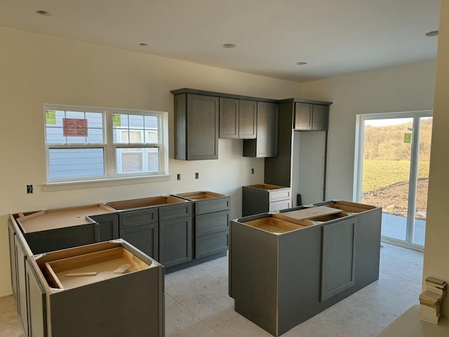 kitchen with gray cabinets and a kitchen island