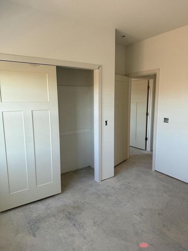 unfurnished bedroom with a closet