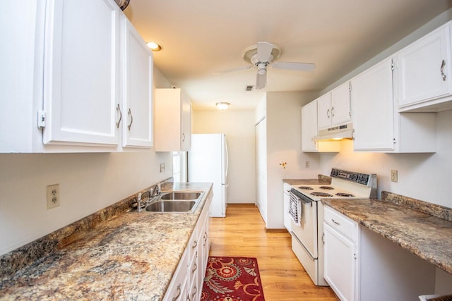 kitchen featuring white appliances, sink, ceiling fan, light stone counters, and white cabinetry