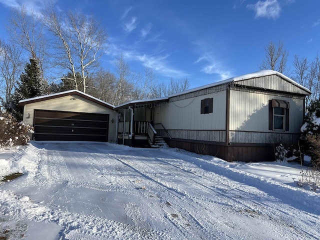 manufactured / mobile home featuring a garage