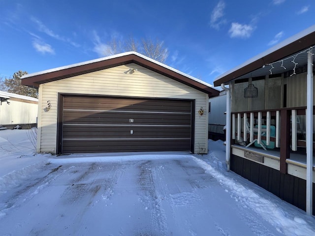 view of snow covered garage