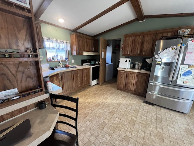 kitchen with white gas stove, lofted ceiling with beams, stainless steel refrigerator with ice dispenser, and sink