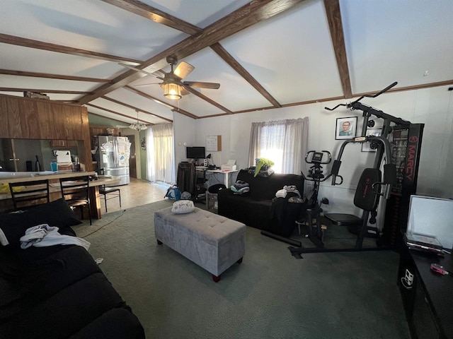 carpeted living room with lofted ceiling with beams and ceiling fan