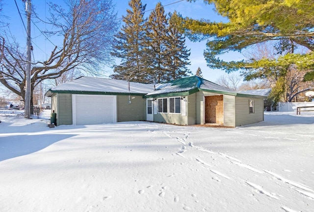 single story home featuring a garage