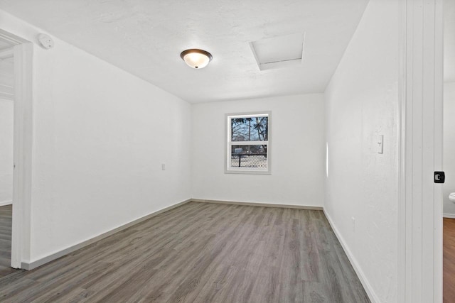 spare room featuring hardwood / wood-style floors