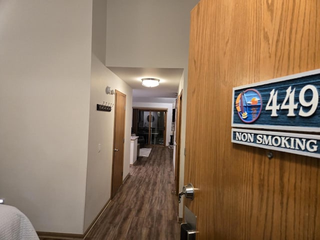 hall with dark hardwood / wood-style flooring