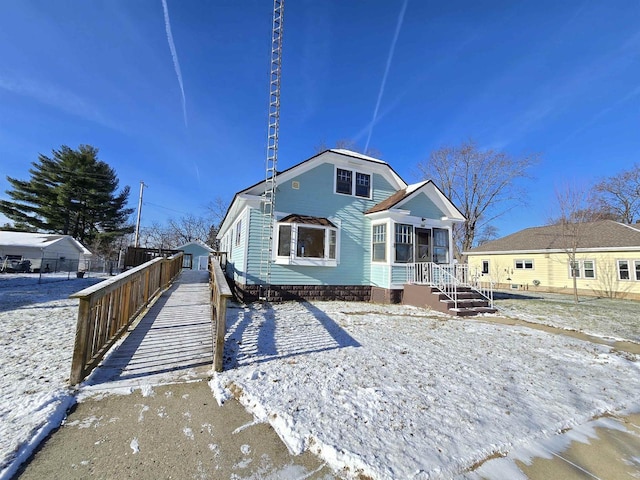 view of front of property featuring fence