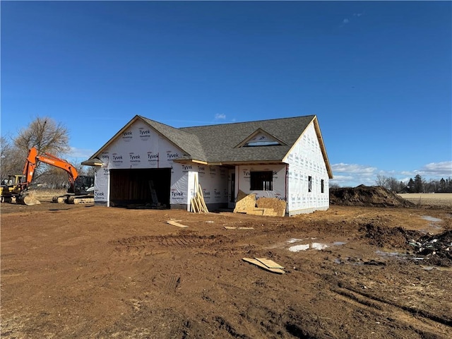 property in mid-construction featuring a garage