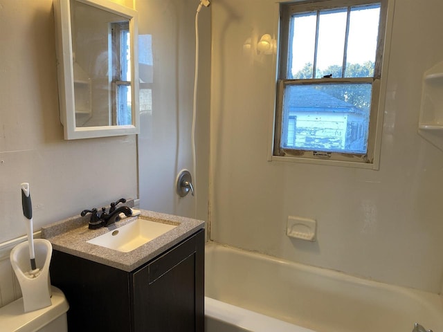 bathroom featuring bathing tub / shower combination and vanity