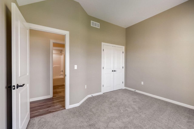 unfurnished bedroom with light colored carpet