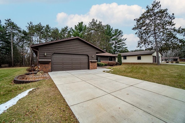 single story home featuring a front lawn and a garage