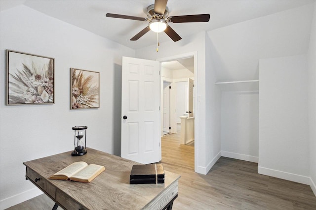 office space with hardwood / wood-style floors and ceiling fan