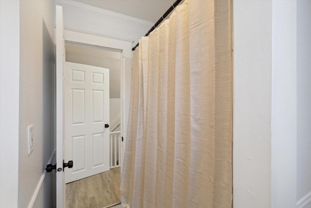 corridor with light hardwood / wood-style flooring