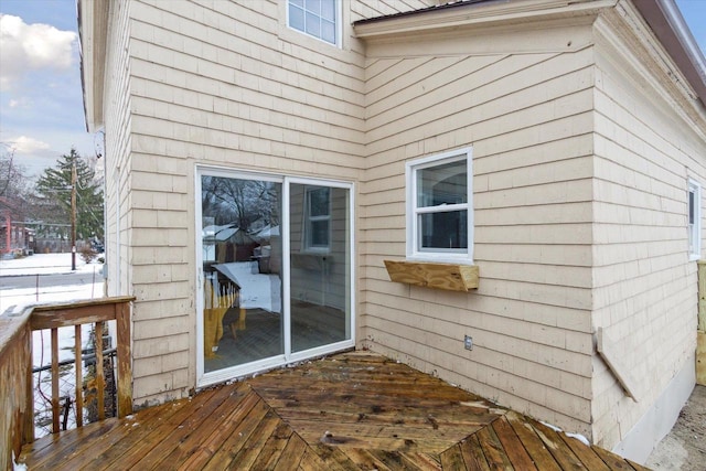 view of snow covered deck