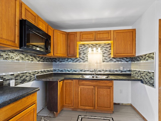 kitchen featuring sink and tasteful backsplash