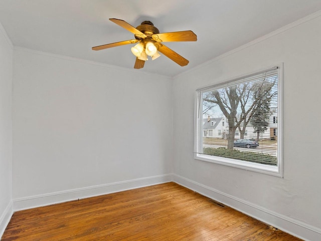 unfurnished room featuring light wood-type flooring, ceiling fan, and ornamental molding